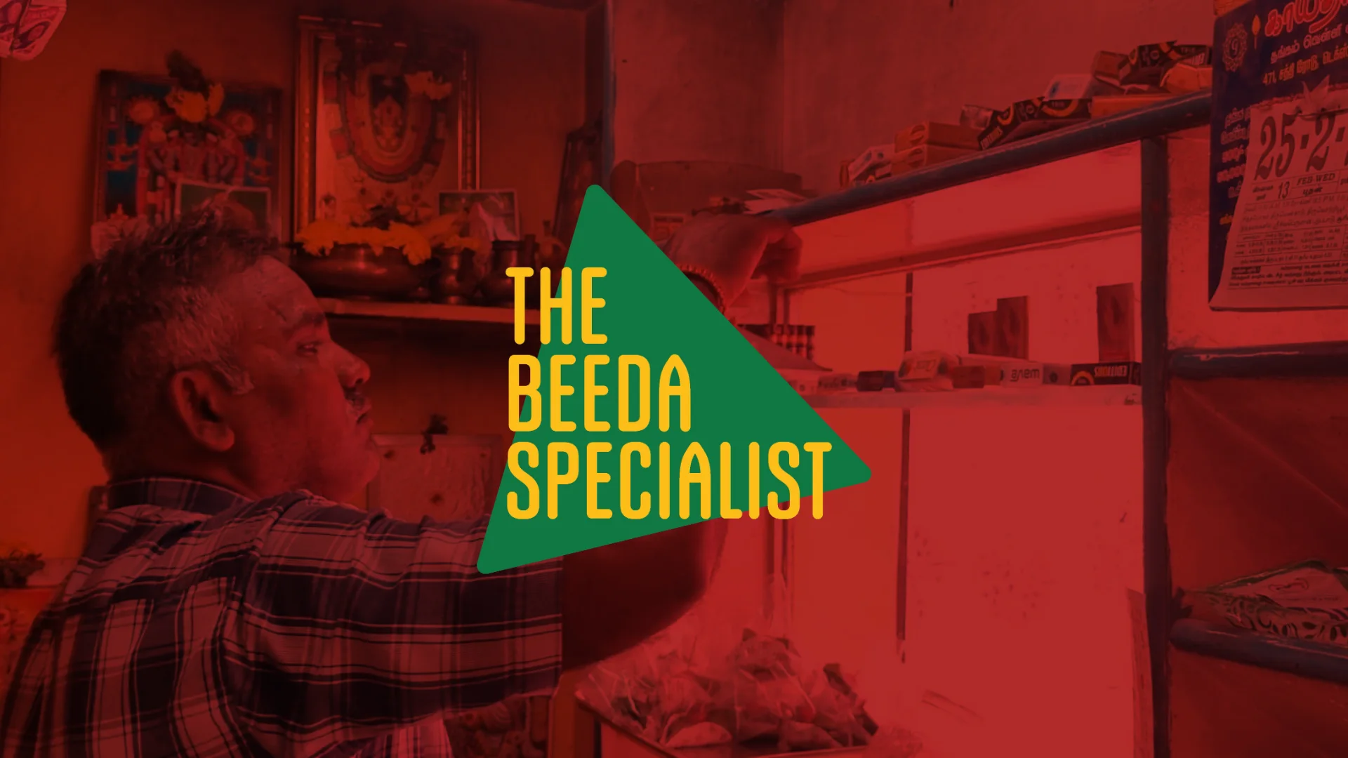 The final logo: The Beeda Specialist in yellow on a green triangle, over a photo of the shopkeeper