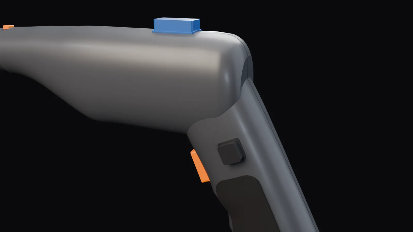 Close-up of the handle top: the blue selector on the barrel, the orange trigger and the reverse button